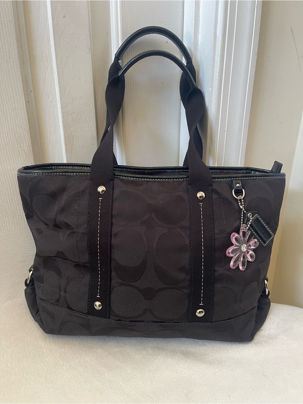Coach Black Signature Tote with Pink Flower Charm Accent